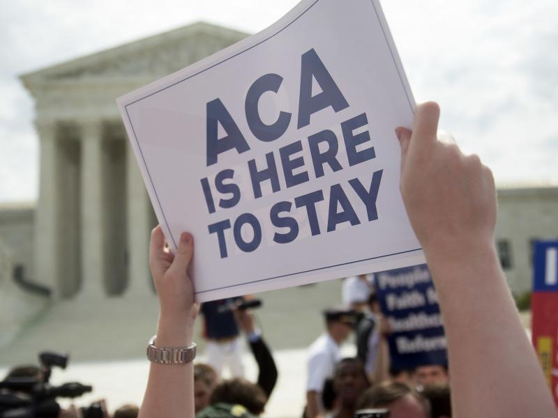 A demonstrator celebrated outside the U.S. Supreme Court in 2015 after the court voted to uphold key tax subsidies that are part of the Affordable Care Act. But federal taxes and other measures designed to pay for the health care the ACA provides have not A demonstrator celebrated outside the U.S. Supreme Court in 2015 after the court voted to uphold key tax subsidies that are part of the Affordable Care Act. But federal taxes and other measures designed to pay for the health care the ACA provides have not
