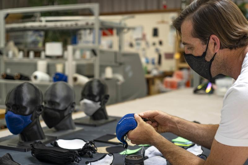 Billy Smith counts rows in the knit structure of a mask to ensure that specifications for fit and sizing meet company standards. Billy Smith counts rows in the knit structure of a mask to ensure that specifications for fit and sizing meet company standards.