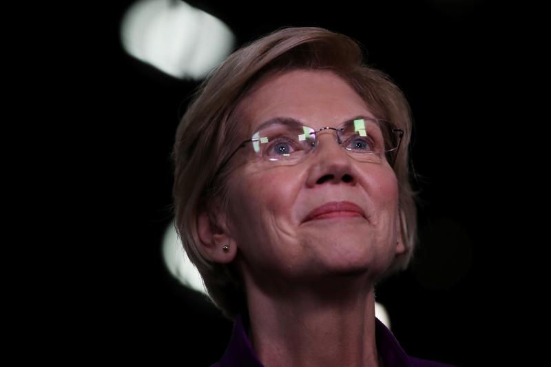 Sen. Elizabeth Warren, D-Mass., speaks to the media in the spin room after the first night of the Democratic presidential debate in Miami last month. Sen. Elizabeth Warren, D-Mass., speaks to the media in the spin room after the first night of the Democratic presidential debate in Miami last month.
