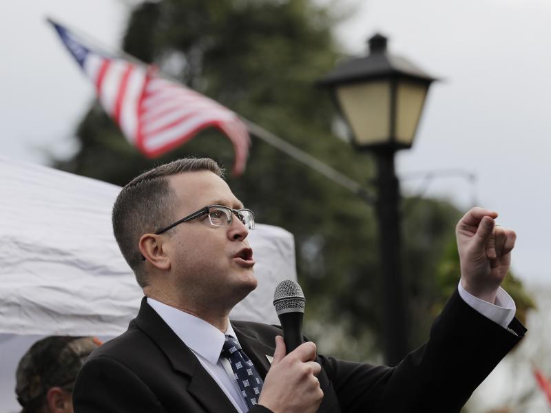 Republican state Rep. Matt Shea, pictured at at a gun-rights rally in January, has been suspended from the House Republican Caucus. He was also removed from several committees. Republican state Rep. Matt Shea, pictured at at a gun-rights rally in January, has been suspended from the House Republican Caucus. He was also removed from several committees.