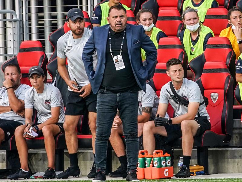 Coach Richie Burke of the Washington Spirit watches the play during a game against the North Carolina Courage at Audi Field on July 10, 2021 in Washington, DC. Coach Richie Burke of the Washington Spirit watches the play during a game against the North Carolina Courage at Audi Field on July 10, 2021 in Washington, DC.