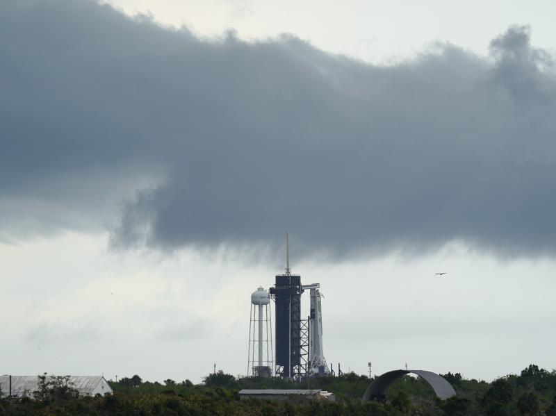 Clouds pass over the SpaceX Falcon 9, with the Crew Dragon spacecraft on top of the rocket on Launch Pad 39-A on Wednesday at Kennedy Space Center in Cape Canaveral, Fla. Clouds pass over the SpaceX Falcon 9, with the Crew Dragon spacecraft on top of the rocket on Launch Pad 39-A on Wednesday at Kennedy Space Center in Cape Canaveral, Fla.