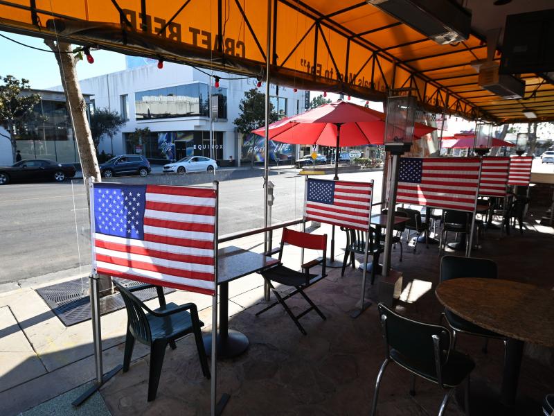 Patio tables are empty at a diner this week in West Hollywood, Calif., after Los Angeles County banned outdoor dining amid the pandemic. The struggles of restaurants and retailers are expected to have led to sharply slower job growth last month. Patio tables are empty at a diner this week in West Hollywood, Calif., after Los Angeles County banned outdoor dining amid the pandemic. The struggles of restaurants and retailers are expected to have led to sharply slower job growth last month.