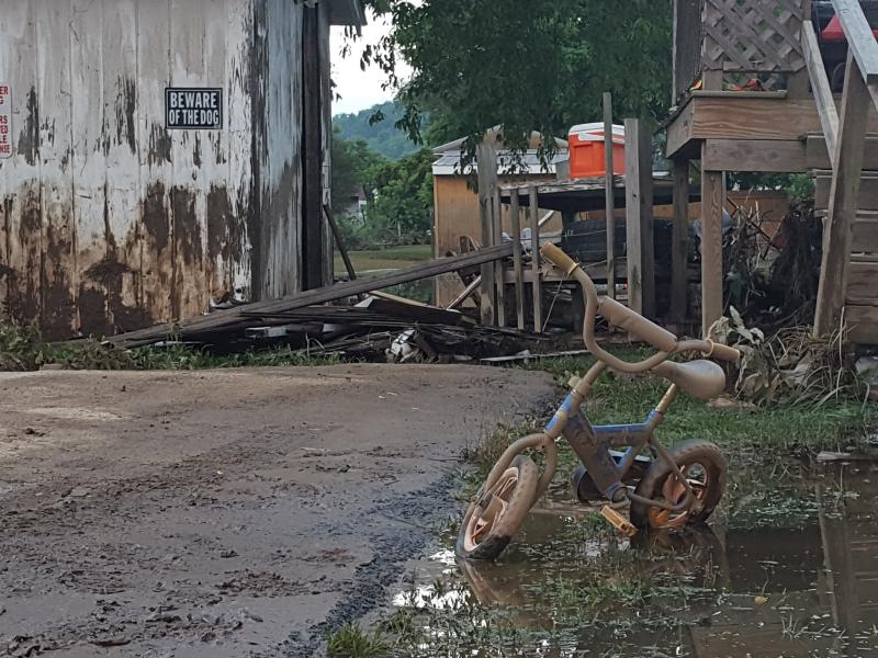 Days after deadly floods swept through West Virginia, everything in the front yard of a home in Rainelle is still caked in mud. Days after deadly floods swept through West Virginia, everything in the front yard of a home in Rainelle is still caked in mud.