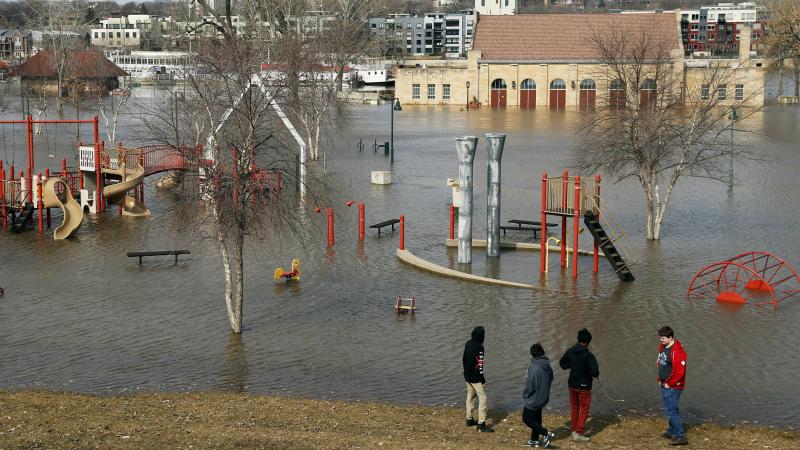 Mississippi River floodwaters inundate the pavilion and a play area at Harriet Island in St. Paul, Minn., this past March. Mississippi River floodwaters inundate the pavilion and a play area at Harriet Island in St. Paul, Minn., this past March.