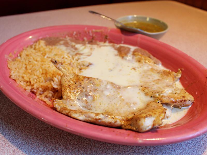 ACP at Cancun Restaurant in Crossville, Tenn. This cheese-covered Southern interpretation of arroz con pollo is not the saffron-colored rice and golden chicken that many Latinos who grew up eating the dish would recognize. But ACP nonetheless helped build ACP at Cancun Restaurant in Crossville, Tenn. This cheese-covered Southern interpretation of arroz con pollo is not the saffron-colored rice and golden chicken that many Latinos who grew up eating the dish would recognize. But ACP nonetheless helped build