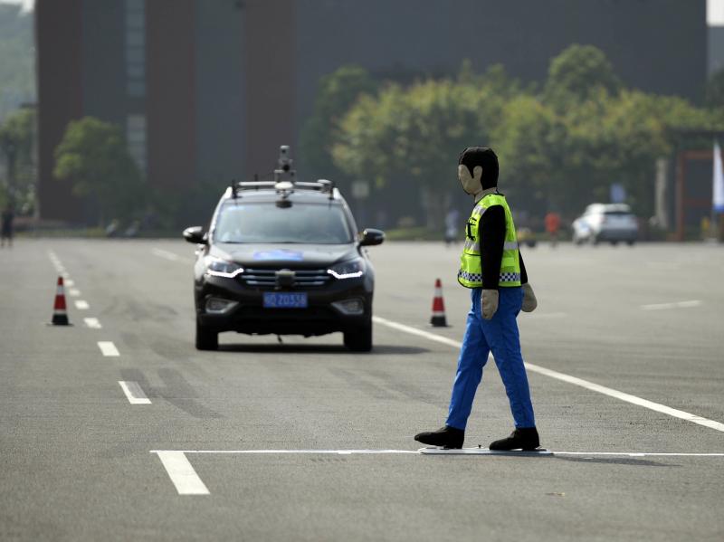 An unmanned automobile competes in the i-VISTA (Intelligent Vehicle Integrated Systems Test Area) Autonomous Driving Challenge on August 18 in Chongqing, China. An unmanned automobile competes in the i-VISTA (Intelligent Vehicle Integrated Systems Test Area) Autonomous Driving Challenge on August 18 in Chongqing, China.