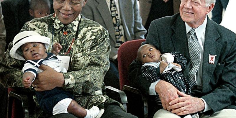 A long legacy in global health: Former President Jimmy Carter has worked to end neglected diseases since 1982. Here he sits with former South African President Nelson Mandela at a ceremony in Soweto, celebrating a new AIDS project in 2002. A long legacy in global health: Former President Jimmy Carter has worked to end neglected diseases since 1982. Here he sits with former South African President Nelson Mandela at a ceremony in Soweto, celebrating a new AIDS project in 2002.