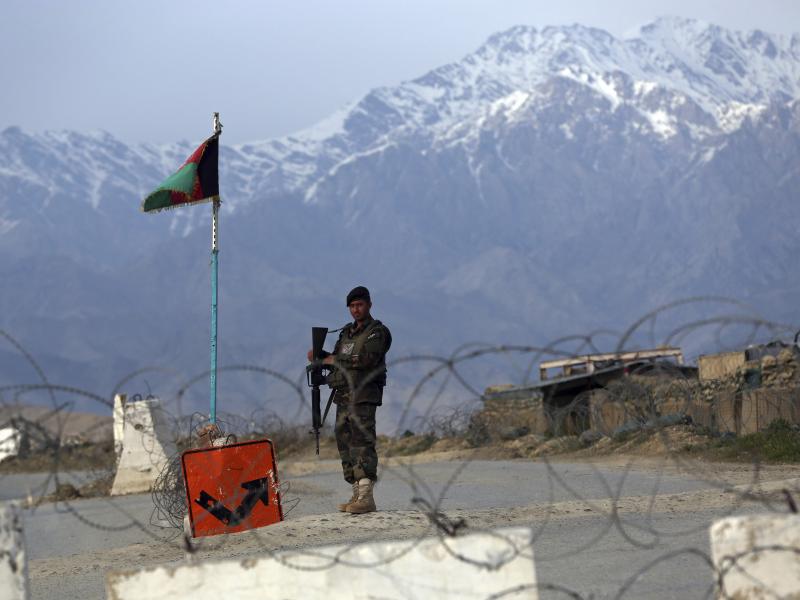 An Afghan National Army soldier stands guard at a checkpoint near the Bagram airfield, the largest U.S. military base in Afghanistan, in April. An Afghan National Army soldier stands guard at a checkpoint near the Bagram airfield, the largest U.S. military base in Afghanistan, in April.