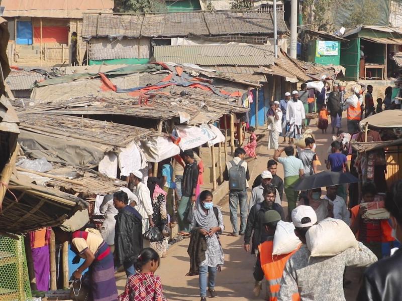 Rohingya refugees walk at the Balukhali refugee camp in Cox's Bazar, Bangladesh, on Feb. 2. Rohingya refugees from Myanmar living in camps in Bangladesh are condemning the military coup in their homeland and saying it makes them more fearful to return. A Rohingya refugees walk at the Balukhali refugee camp in Cox's Bazar, Bangladesh, on Feb. 2. Rohingya refugees from Myanmar living in camps in Bangladesh are condemning the military coup in their homeland and saying it makes them more fearful to return. A