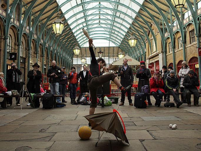 A juggler performs during an audition for a busking spot in the North Hall at Covent Garden Market. A juggler performs during an audition for a busking spot in the North Hall at Covent Garden Market.
