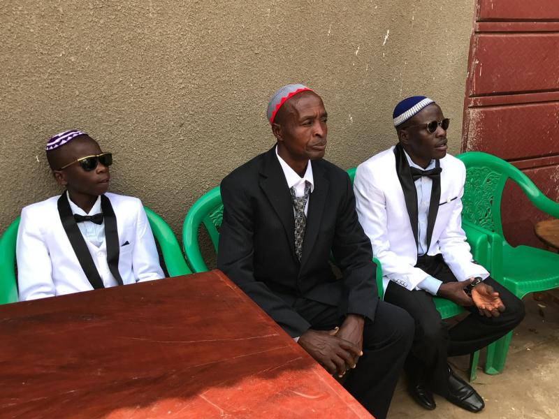 Shadrach Mugoya Levi, right, at his recent wedding in Uganda. From left: his son Oren Levi and Moshe Isiko. Shadrach Mugoya Levi, right, at his recent wedding in Uganda. From left: his son Oren Levi and Moshe Isiko.