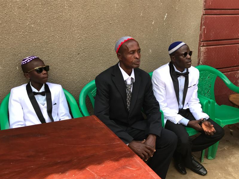 Shadrach Mugoya Levi, right, at his recent wedding in Uganda. From left: his son Oren Levi and Moshe Isiko. Shadrach Mugoya Levi, right, at his recent wedding in Uganda. From left: his son Oren Levi and Moshe Isiko.