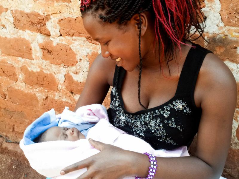 Maria Nalubega holds her three-week-old baby daughter. Maria Nalubega holds her three-week-old baby daughter.