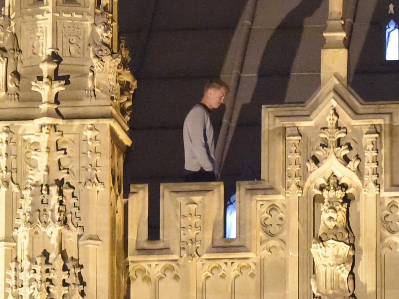 A trespasser stands and walks along the roof at House of Commons early Sunday morning in London. The unidentified man was taken into custody after spending about eight hours wandering around the roof of the Palace of Westminster. A trespasser stands and walks along the roof at House of Commons early Sunday morning in London. The unidentified man was taken into custody after spending about eight hours wandering around the roof of the Palace of Westminster.