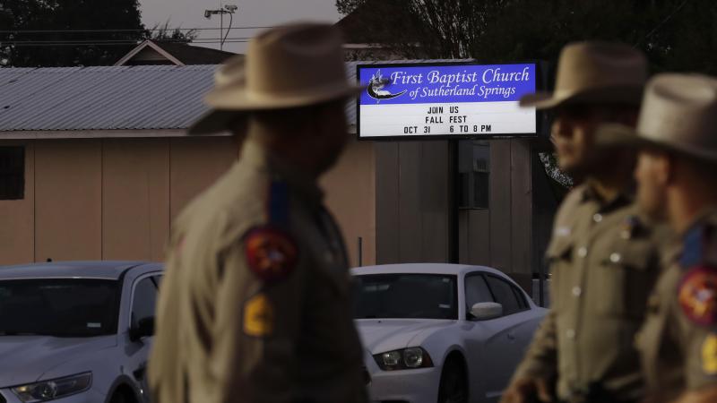 Law enforcement officials gather Monday at the scene of a deadly shooting the previous day at the First Baptist Church of Sutherland Springs in Texas. Law enforcement officials gather Monday at the scene of a deadly shooting the previous day at the First Baptist Church of Sutherland Springs in Texas.