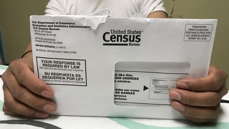 A Rhode Island resident holds an envelope he received for the 2020 census test run in Providence County. A Rhode Island resident holds an envelope he received for the 2020 census test run in Providence County.