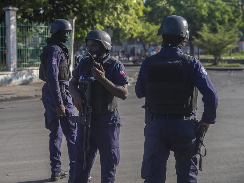 Armed forces secure the area where Haiti's prime minister, Ariel Henry, placed a bouquet of flowers in front of a memorial to independence hero Jean-Jacques Dessalines in Port-au-Prince, Haiti, on Sunday. Haitian police are working with U.S. officials and Armed forces secure the area where Haiti's prime minister, Ariel Henry, placed a bouquet of flowers in front of a memorial to independence hero Jean-Jacques Dessalines in Port-au-Prince, Haiti, on Sunday. Haitian police are working with U.S. officials and