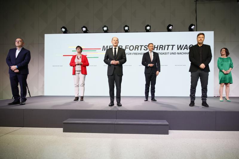 Members of three German parties at the signing of a coalition agreement are (from left) Social Democrats Norbert Walter-Borjan, Saskia Esken and new Chancellor Olaf Scholz, Free Democrat Christian Lindner, and the Green party's Robert Habeck and Annalena Members of three German parties at the signing of a coalition agreement are (from left) Social Democrats Norbert Walter-Borjan, Saskia Esken and new Chancellor Olaf Scholz, Free Democrat Christian Lindner, and the Green party's Robert Habeck and Annalena
