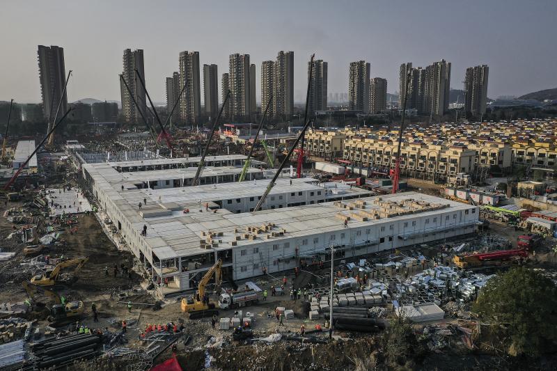 On Jan. 23, workers started building the Huoshenshan hospital for COVID-19 patients in Wuhan, China. The photo above was taken on Jan. 30. Construction was done on Feb. 2, and the 1,000-bed hospital opened on Feb. 3. Today it stands empty of patients. On Jan. 23, workers started building the Huoshenshan hospital for COVID-19 patients in Wuhan, China. The photo above was taken on Jan. 30. Construction was done on Feb. 2, and the 1,000-bed hospital opened on Feb. 3. Today it stands empty of patients.