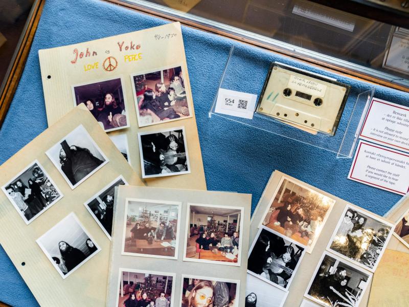 A cassette with the recording of teenage journalists' 1970 interview with John Lennon and Yoko Ono, along with polaroid photos from the conversation, seen at Bruun Rasmussen Auction House in Copenhagen on September 24, 2021. An unidentified bidder won the A cassette with the recording of teenage journalists' 1970 interview with John Lennon and Yoko Ono, along with polaroid photos from the conversation, seen at Bruun Rasmussen Auction House in Copenhagen on September 24, 2021. An unidentified bidder won the