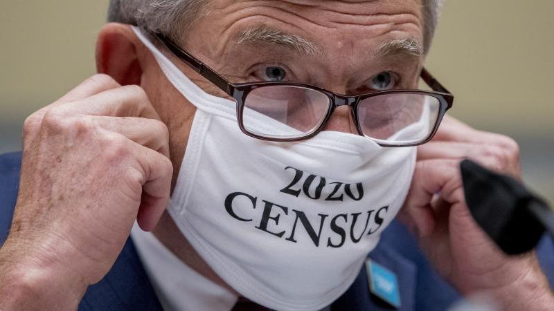 Census Bureau Director Steven Dillingham, wearing a face covering printed with the words "2020 Census," testified before the House oversight committee Wednesday that the bureau plans to finish counting "as soon as possible" despite career officials previo Census Bureau Director Steven Dillingham, wearing a face covering printed with the words "2020 Census," testified before the House oversight committee Wednesday that the bureau plans to finish counting "as soon as possible" despite career officials previo