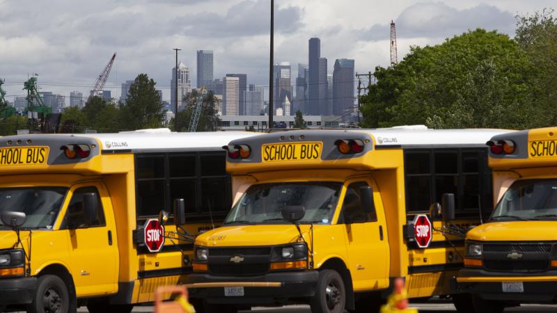 School buses sit idle in a Seattle bus yard. On July 2, Seattle Public Schools announced it is planning to resume some in-person learning in the new school year. School buses sit idle in a Seattle bus yard. On July 2, Seattle Public Schools announced it is planning to resume some in-person learning in the new school year.