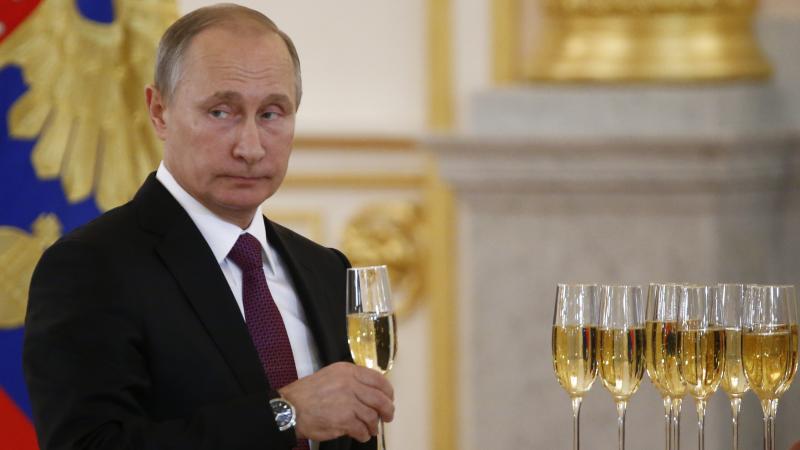 Russian President Putin holds a glass during a ceremony of receiving diplomatic credentials from foreign ambassadors in the Kremlin. President-elect Trump says he wants better relations with Putin. Russian President Putin holds a glass during a ceremony of receiving diplomatic credentials from foreign ambassadors in the Kremlin. President-elect Trump says he wants better relations with Putin.