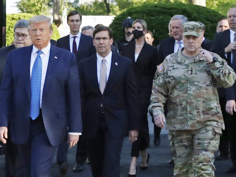 President Trump walking from the White House to St. John's Church on June 1. Gen. Mark Milley (far right), chairman of the Joint Chiefs of Staff, was among those walking behind the president. Milley says his presence was "a mistake" that he has learned fr President Trump walking from the White House to St. John's Church on June 1. Gen. Mark Milley (far right), chairman of the Joint Chiefs of Staff, was among those walking behind the president. Milley says his presence was "a mistake" that he has learned fr