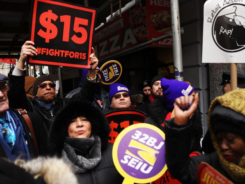 Protesters with NYC Fight for $15 gather in front of a McDonalds. Protesters with NYC Fight for $15 gather in front of a McDonalds.