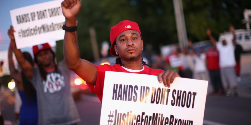 Demonstrators in St. Louis, Mo., protest the killing of Michael Brown. Demonstrators in St. Louis, Mo., protest the killing of Michael Brown.