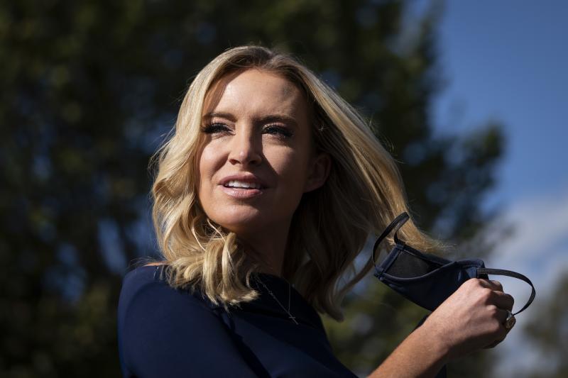 White House press secretary Kayleigh McEnany takes off her face covering before speaking with reporters outside the West Wing of the White House on Friday, the day President Trump announced he had tested positive for the virus. White House press secretary Kayleigh McEnany takes off her face covering before speaking with reporters outside the West Wing of the White House on Friday, the day President Trump announced he had tested positive for the virus.