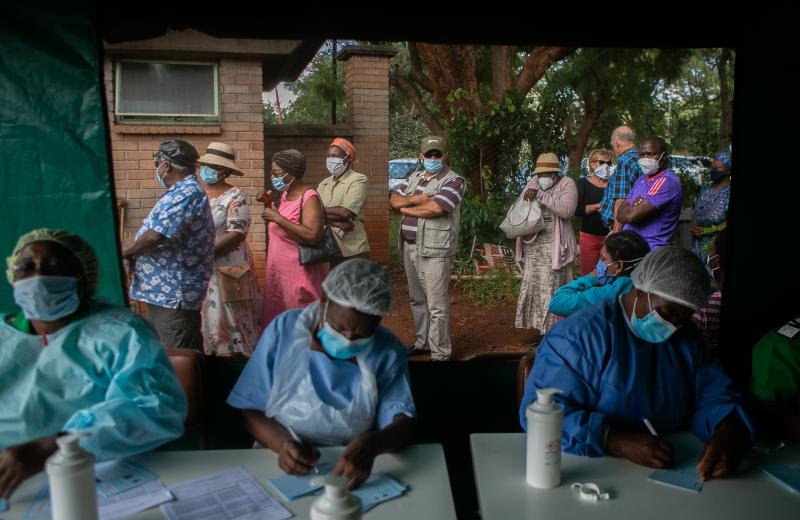 People line up to get the Sinopharm vaccine in Harare, Zimbabwe. World leaders promised to speed up vaccine distribution to low- and middle-income countries at the White House's second Global COVID-19 Summit on May 12. People line up to get the Sinopharm vaccine in Harare, Zimbabwe. World leaders promised to speed up vaccine distribution to low- and middle-income countries at the White House's second Global COVID-19 Summit on May 12.