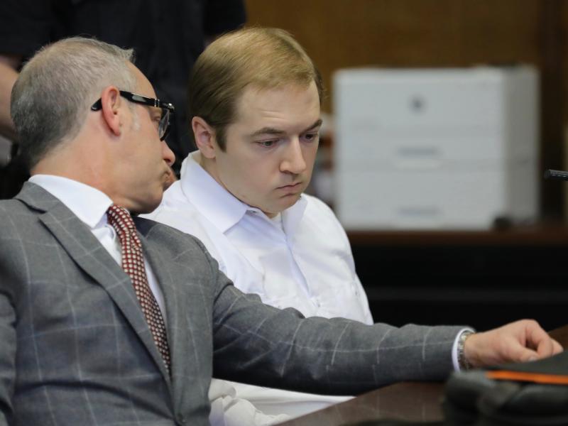James Jackson, right, confers with his lawyer during a hearing in criminal court Wednesday in New York. Jackson pleaded guilty to killing a black man with a sword, which prosecutors described as terrorism and a hate crime. James Jackson, right, confers with his lawyer during a hearing in criminal court Wednesday in New York. Jackson pleaded guilty to killing a black man with a sword, which prosecutors described as terrorism and a hate crime.