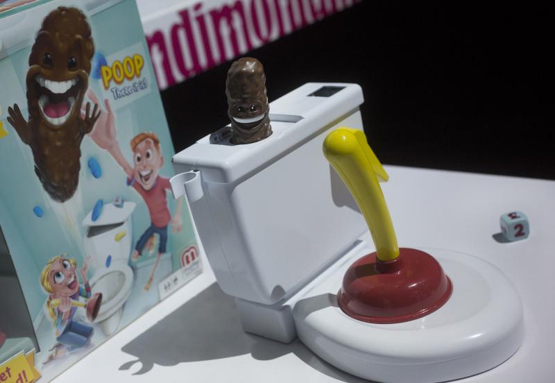 G.I. Woe: Mattel's Flushin' Frenzy sends a brown plastic poop flying into the air. It's pictured above at Toy Fair in New York in February 2018. G.I. Woe: Mattel's Flushin' Frenzy sends a brown plastic poop flying into the air. It's pictured above at Toy Fair in New York in February 2018.