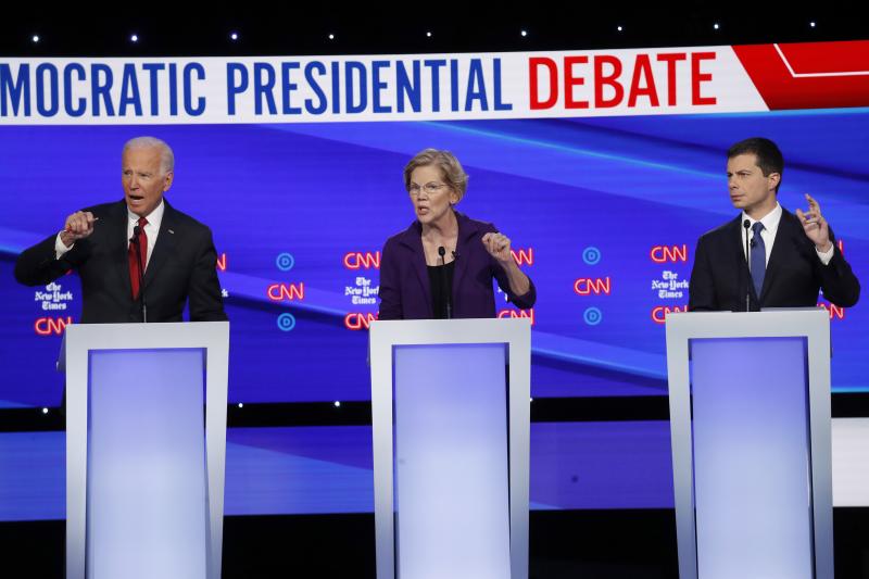 Democratic presidential candidates former Vice President Joe Biden (left), Sen. Elizabeth Warren, D-Mass., and South Bend, Ind., Mayor Pete Buttigieg (right) debate different ways to expand health coverage in America. Democratic presidential candidates former Vice President Joe Biden (left), Sen. Elizabeth Warren, D-Mass., and South Bend, Ind., Mayor Pete Buttigieg (right) debate different ways to expand health coverage in America.