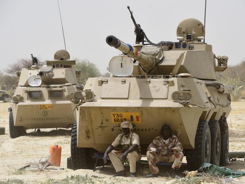 Chadian soldiers rest in the shade of their armored vehicle near Malam Fatori in April 2015, after troops retook the town from Boko Haram. Chadian soldiers rest in the shade of their armored vehicle near Malam Fatori in April 2015, after troops retook the town from Boko Haram.