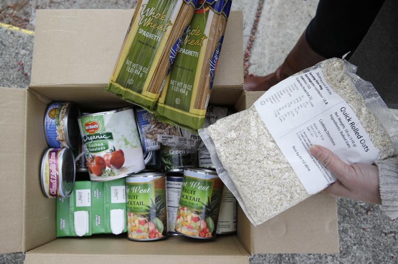 A box of food prepared at a food bank distribution in Petaluma, Calif. The state ranks near the bottom in enrolling people for food assistance. To change that, it's taking lessons from its robust Medi-Cal health insurance program, which targets much the s A box of food prepared at a food bank distribution in Petaluma, Calif. The state ranks near the bottom in enrolling people for food assistance. To change that, it's taking lessons from its robust Medi-Cal health insurance program, which targets much the s