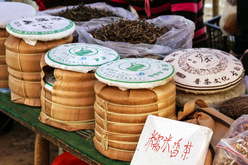 Pu'er tea is packed in bings at a market in China's Yunnan province. A cake of Pu'er continues to change as it ages, and bits of tea are chipped off in order to brew. Pu'er tea is packed in bings at a market in China's Yunnan province. A cake of Pu'er continues to change as it ages, and bits of tea are chipped off in order to brew.