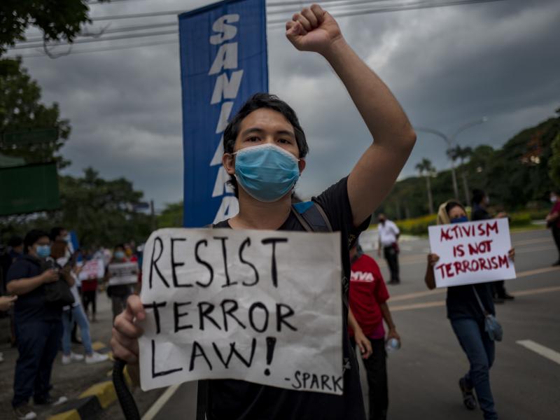 A protester wearing a face mask demonstrates against the Philippines' new anti-terrorism law on July 4, in Quezon city, Metro Manila. Earlier this month, President Rodrigo Duterte approved a law that critics say could lead to more human rights abuses. A protester wearing a face mask demonstrates against the Philippines' new anti-terrorism law on July 4, in Quezon city, Metro Manila. Earlier this month, President Rodrigo Duterte approved a law that critics say could lead to more human rights abuses.