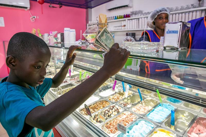 A young boy eyes his options at Nice Cream. A young boy eyes his options at Nice Cream.