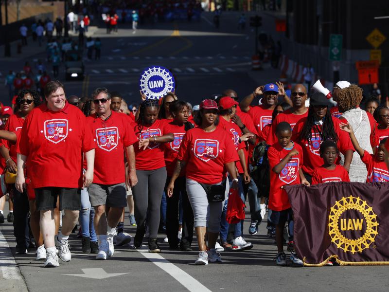 United Auto Workers members walk in the Labor Day parade' in Detroit, Monday, Sept. 2, 2019. United Auto Workers members walk in the Labor Day parade' in Detroit, Monday, Sept. 2, 2019.