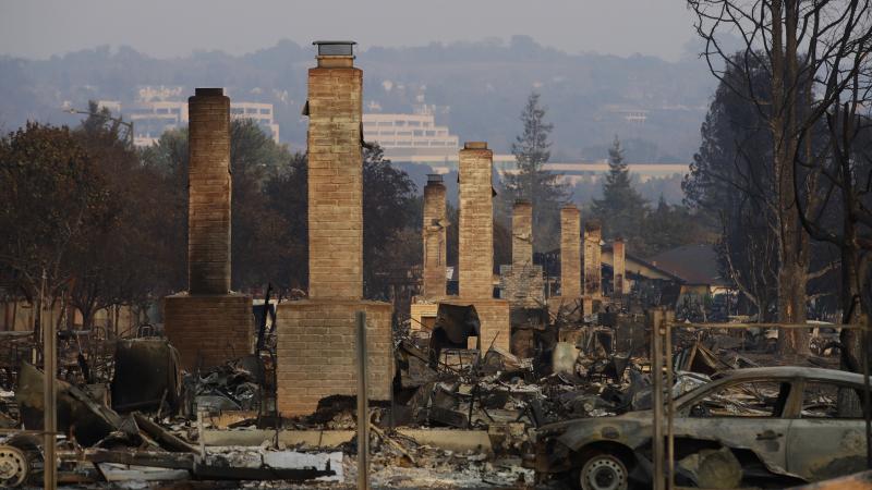 A row of chimneys stand in a neighborhood devastated by a wildfire on Oct. 13, 2017, near Santa Rosa, Calif. Massive wildfires swept through Northern California two months ago, destroying thousands of homes and businesses. A row of chimneys stand in a neighborhood devastated by a wildfire on Oct. 13, 2017, near Santa Rosa, Calif. Massive wildfires swept through Northern California two months ago, destroying thousands of homes and businesses.
