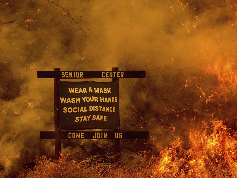 Flames from the LNU Lightning Complex fires burn in unincorporated Napa County, Calif., on Tuesday. Flames from the LNU Lightning Complex fires burn in unincorporated Napa County, Calif., on Tuesday.
