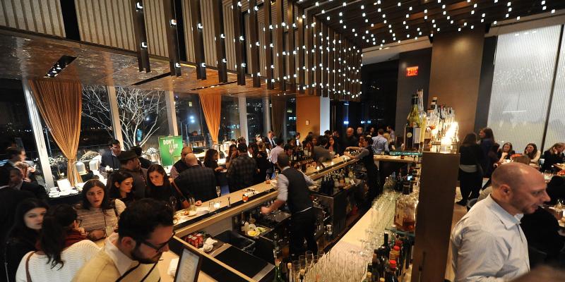 Diners fill Riverpark, a New York City restaurant, in January. Restaurateurs fear that the tipped-wage hike being proposed in New York will force them to get rid of tipping altogether. Diners fill Riverpark, a New York City restaurant, in January. Restaurateurs fear that the tipped-wage hike being proposed in New York will force them to get rid of tipping altogether.