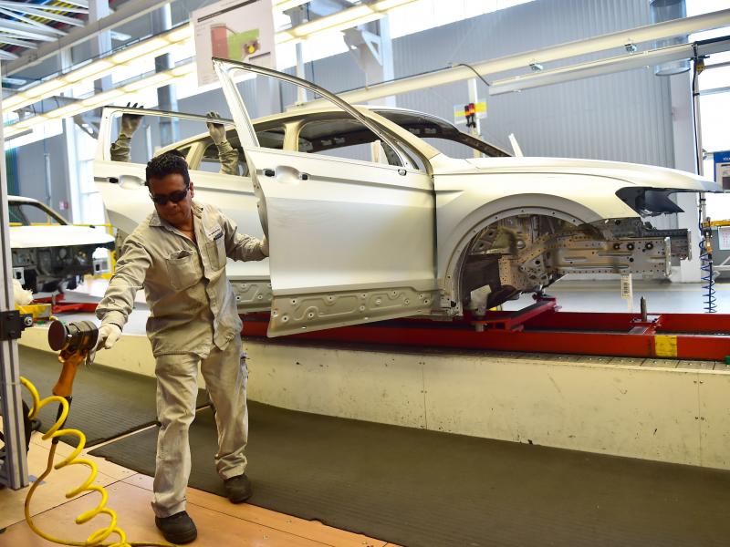 Employees work on the assembly line of the Tiguan model at the Volkswagen car plant in Puebla, central Mexico, in March. The auto sector is a key focus of the newly revised North American Free Trade Agreement. Employees work on the assembly line of the Tiguan model at the Volkswagen car plant in Puebla, central Mexico, in March. The auto sector is a key focus of the newly revised North American Free Trade Agreement.