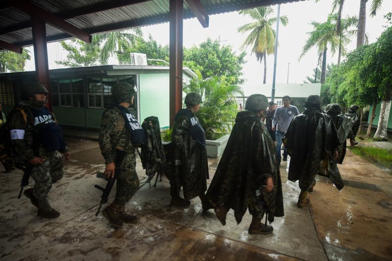 Mexican Marines guard a shelter in Escuinapa, Sinaloa state on Tuesday. Mexican Marines guard a shelter in Escuinapa, Sinaloa state on Tuesday.