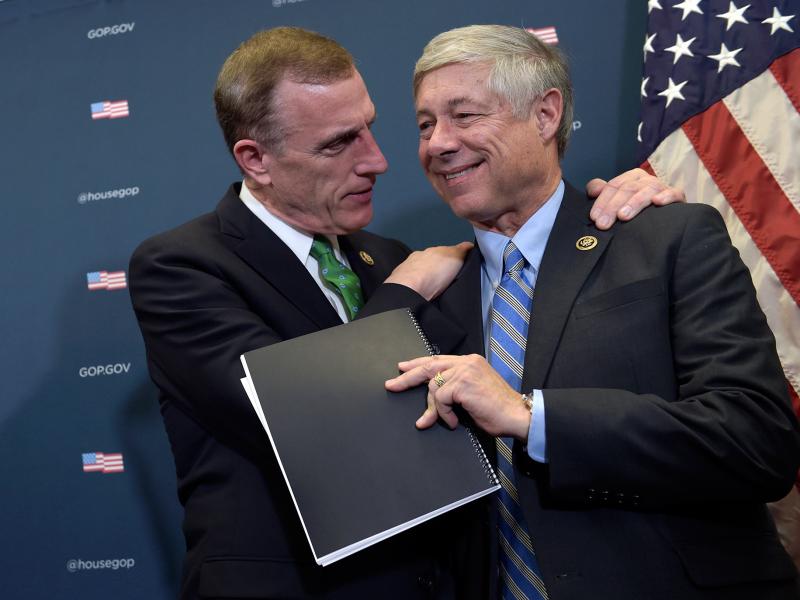 Rep. Tim Murphy, R-Pa., embraces Rep. Fred Upton, R-Mich., during a media briefing about the 21st Century Cures Act on Capitol Hill Wednesday. Rep. Tim Murphy, R-Pa., embraces Rep. Fred Upton, R-Mich., during a media briefing about the 21st Century Cures Act on Capitol Hill Wednesday.