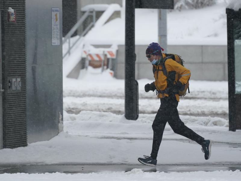 A person runs in the snow on Saturday on the University of Washington campus in Seattle. Winter weather was expected to continue through the weekend in the region. Winter conditions are forecast to extend through much of the U.S. early into the week. A person runs in the snow on Saturday on the University of Washington campus in Seattle. Winter weather was expected to continue through the weekend in the region. Winter conditions are forecast to extend through much of the U.S. early into the week.