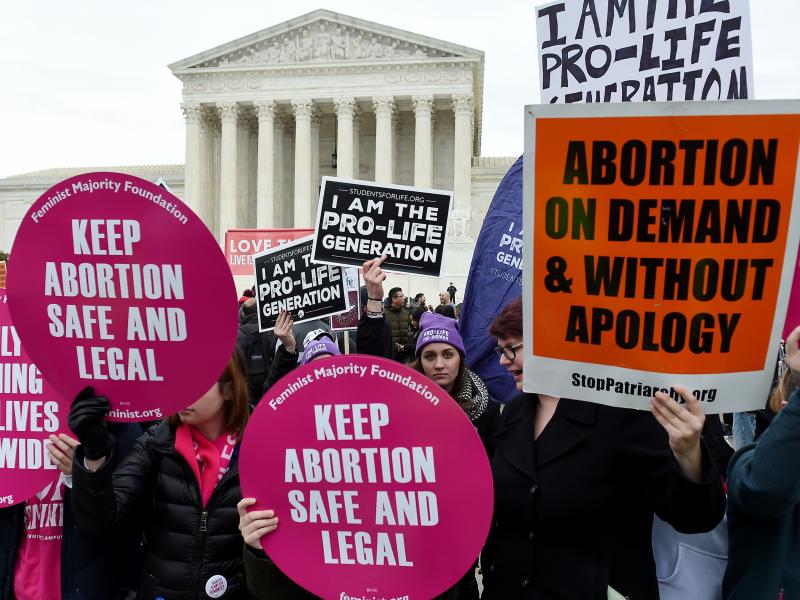 Activists on opposite sides of the abortion debate demonstrate in front of the Supreme Court during the annual anti-abortion-rights event known as the March for Life, on Jan. 24 in Washington, D.C. Activists on opposite sides of the abortion debate demonstrate in front of the Supreme Court during the annual anti-abortion-rights event known as the March for Life, on Jan. 24 in Washington, D.C.